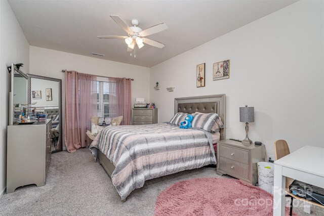 carpeted bedroom featuring ceiling fan