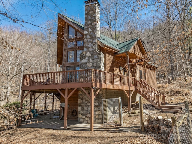 exterior space featuring stairs and a deck