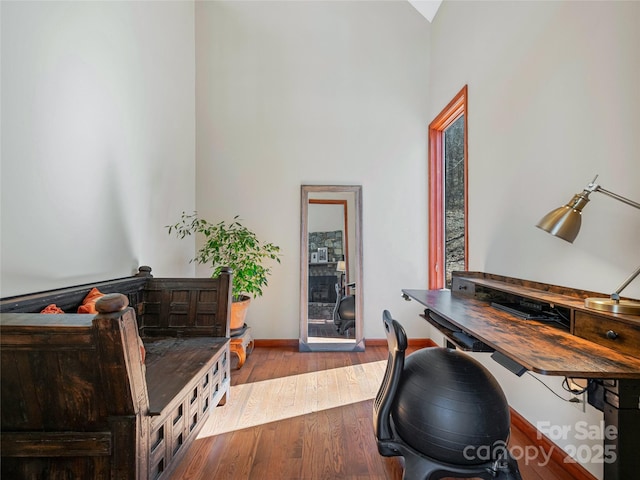 office space featuring baseboards and hardwood / wood-style floors