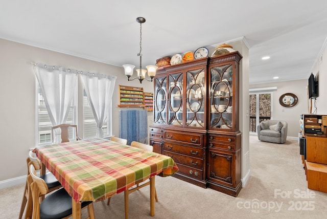 dining area with baseboards, light colored carpet, ornamental molding, a chandelier, and recessed lighting