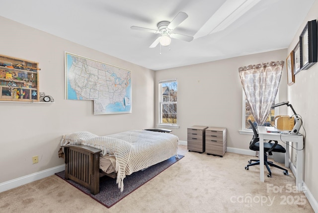 bedroom with ceiling fan, baseboards, and light colored carpet