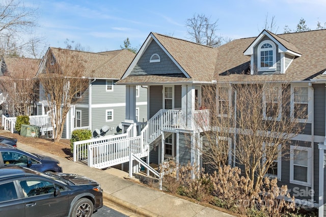 view of front of property featuring a shingled roof