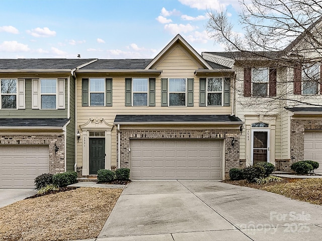 multi unit property featuring a garage