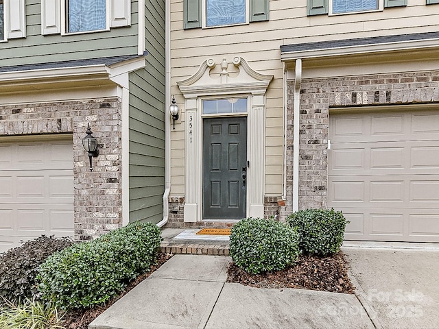 entrance to property featuring a garage