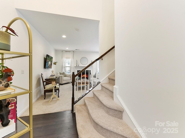 stairway featuring wood-type flooring