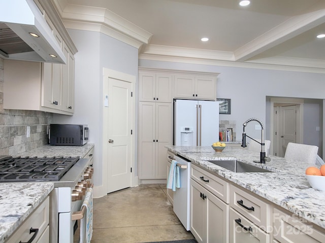 kitchen with premium range hood, sink, high end appliances, light stone counters, and backsplash