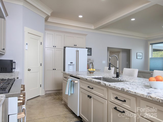 kitchen with high end white refrigerator, sink, light stone counters, ornamental molding, and dishwasher