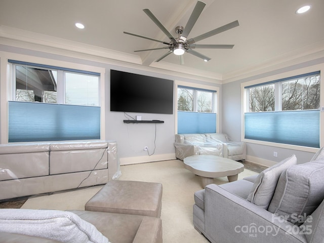 living room featuring ceiling fan, light colored carpet, and ornamental molding