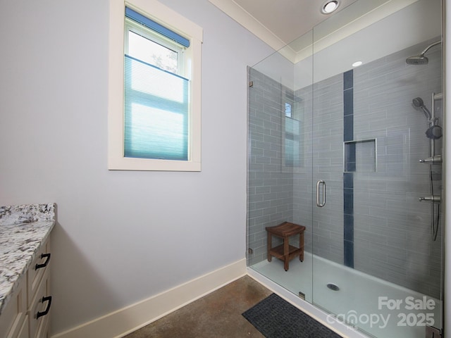 bathroom featuring vanity, crown molding, a shower with shower door, and concrete floors