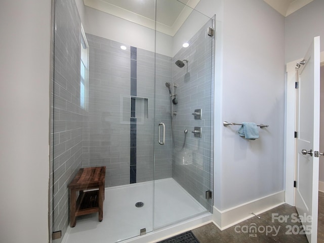 bathroom featuring a shower with door