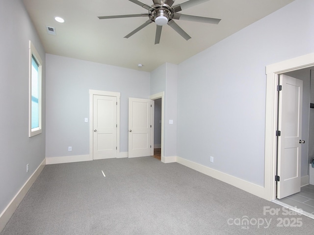 unfurnished bedroom with light carpet and ceiling fan