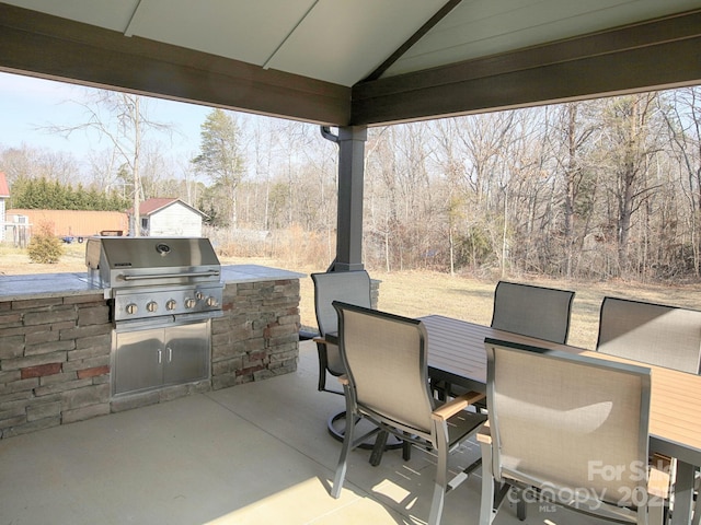 view of patio featuring a grill, area for grilling, and a gazebo