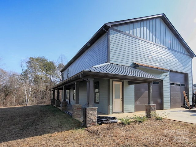 view of front of home featuring a garage and a porch