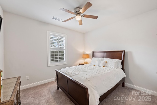 bedroom featuring light colored carpet and ceiling fan