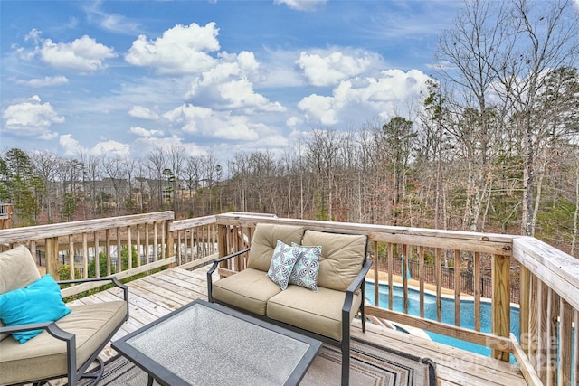 wooden terrace with an outdoor living space