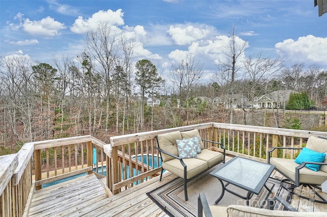 wooden deck featuring an outdoor living space