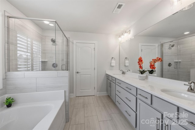 bathroom with vanity and plus walk in shower