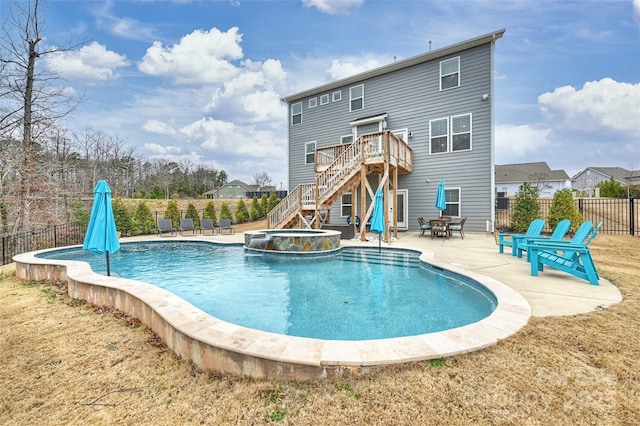 view of swimming pool with an in ground hot tub, a deck, and a patio area