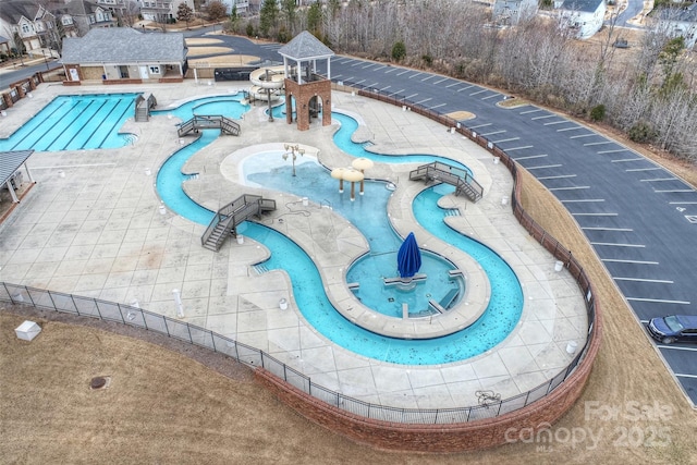 view of pool with a patio area and a water slide