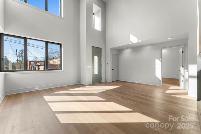 unfurnished living room with light wood-type flooring