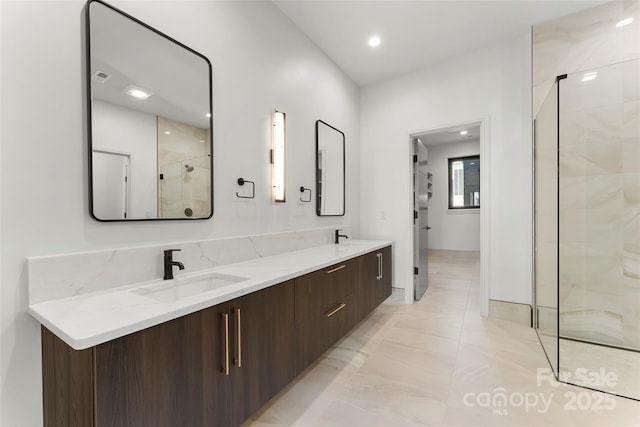 bathroom with vanity and an enclosed shower