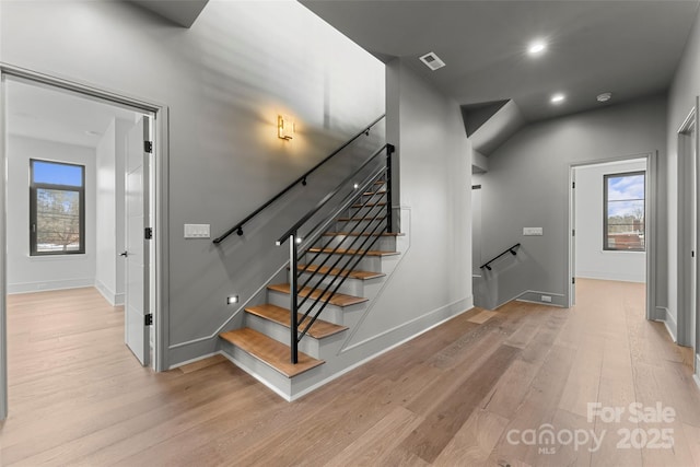 stairway featuring hardwood / wood-style flooring