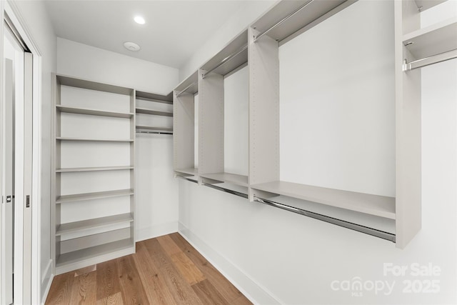 walk in closet featuring light wood-type flooring