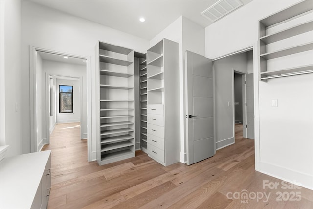 walk in closet featuring light wood-type flooring