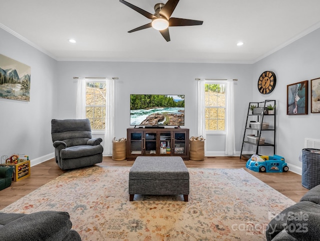 living room featuring crown molding, recessed lighting, wood finished floors, and baseboards