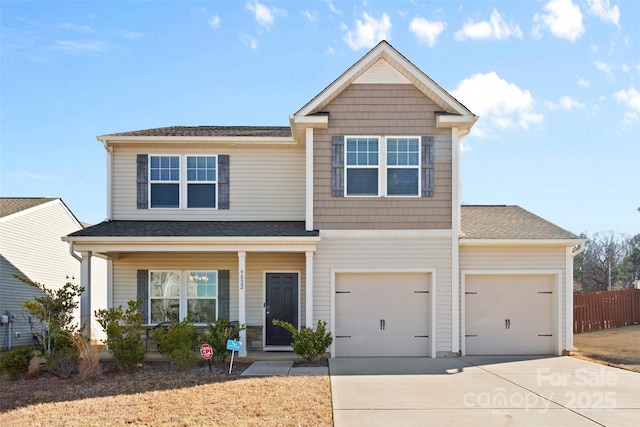 view of front of house with a garage and covered porch