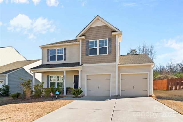 view of front of home with a garage and covered porch