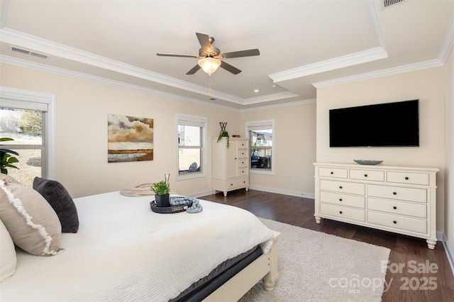 bedroom featuring dark wood-style floors, visible vents, and ornamental molding