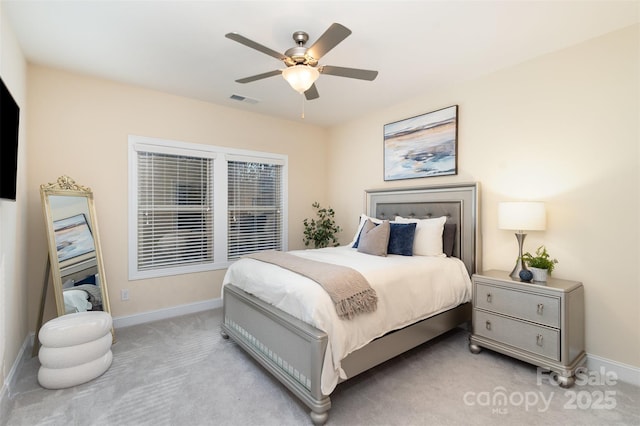 bedroom with a ceiling fan, light colored carpet, visible vents, and baseboards