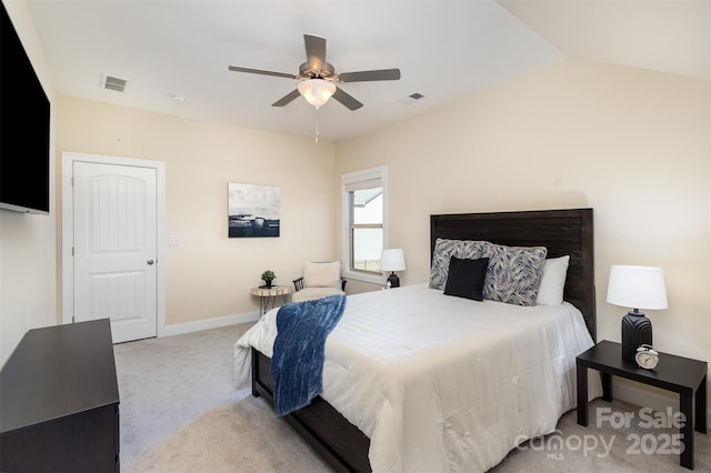 bedroom with carpet floors, visible vents, vaulted ceiling, ceiling fan, and baseboards