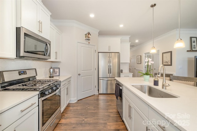 kitchen featuring stainless steel appliances, a sink, light countertops, and white cabinets