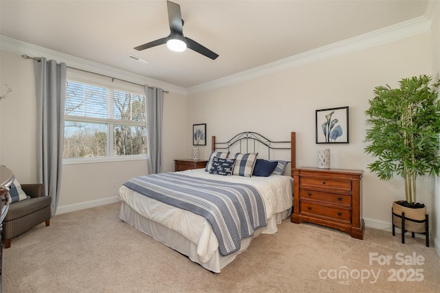 bedroom featuring ornamental molding, light carpet, visible vents, and baseboards