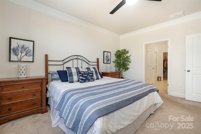 bedroom with light carpet, baseboards, visible vents, ceiling fan, and crown molding