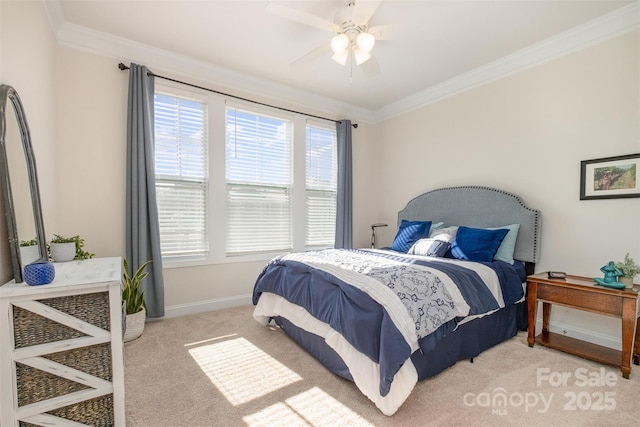 bedroom with baseboards, ceiling fan, carpet, and crown molding