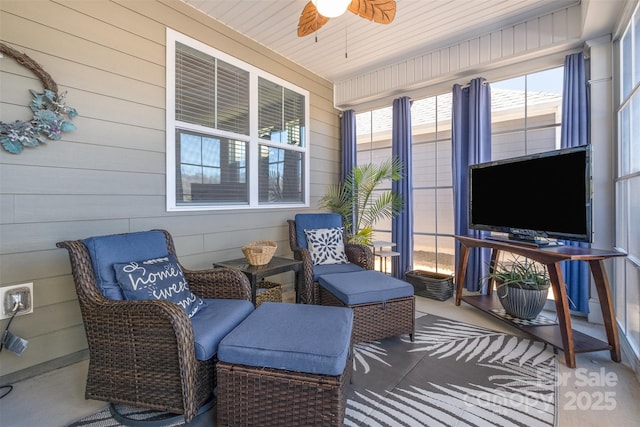 sunroom with a ceiling fan