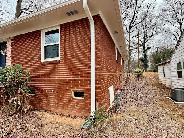 view of property exterior featuring central AC