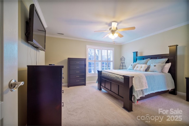 bedroom with light carpet, ornamental molding, and ceiling fan