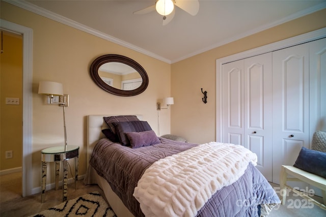 carpeted bedroom featuring crown molding, a closet, and ceiling fan