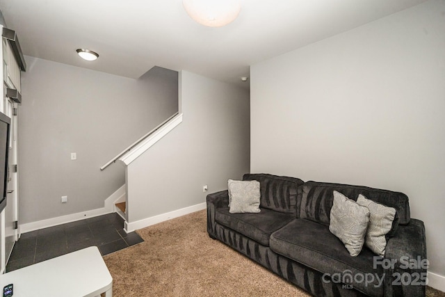 living room with dark colored carpet