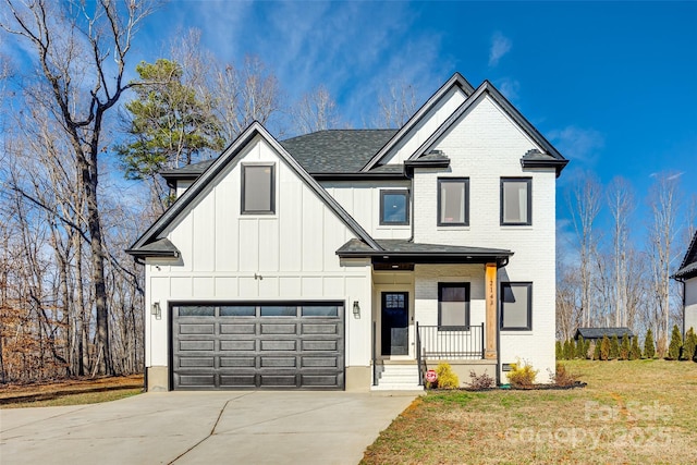 view of front of property with a garage, a porch, and a front lawn