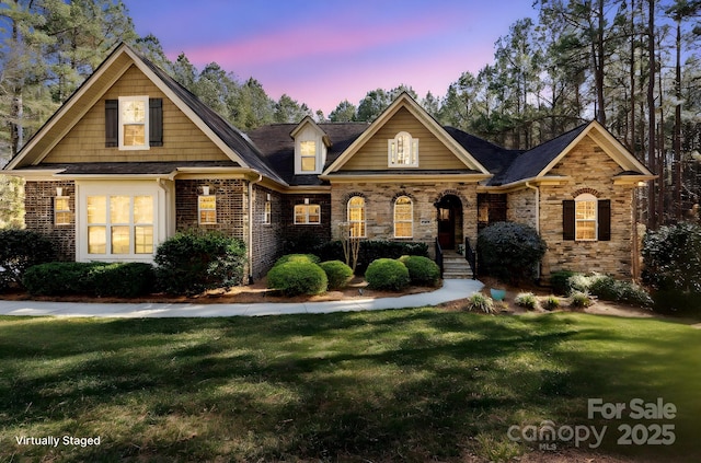 view of front of property with a yard