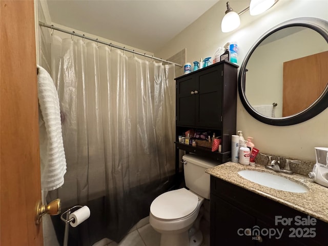 full bathroom with vanity, tile patterned flooring, toilet, and shower / bath combo with shower curtain