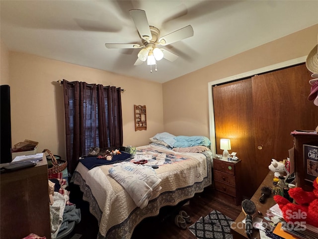 bedroom with ceiling fan and wood-type flooring