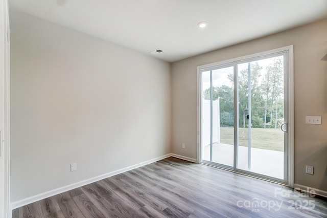 spare room with light hardwood / wood-style floors