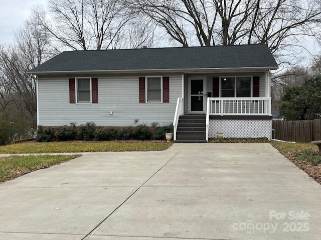 single story home with a porch