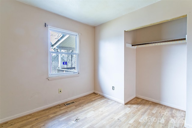 unfurnished bedroom featuring light wood-type flooring